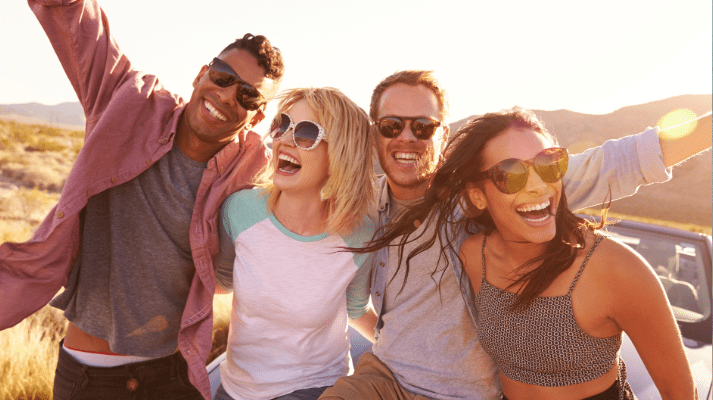 friends on road trip wearing sunglasses